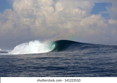 Large Blue Ocean Surfing Wave