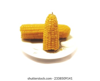 Large boiled corn in a small dish ready to eat.