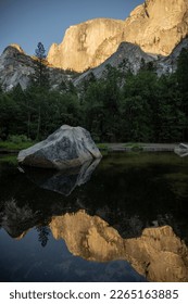 Large Boulder And Half Dome Reflect In Mirror Lake in Yosemite
