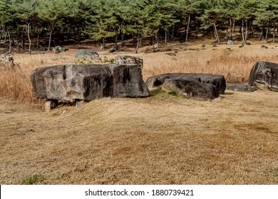 Large boulders used as capstone on dolmen burial chamber in neolithic park.