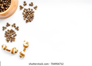 Large Bowl Of Pet - Dog Food Spilling In Paw Print On White Background Top View Mockup