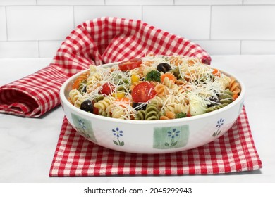 A Large Bowl Of Tri Color Pasta Salad, Close Up.