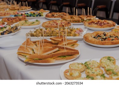 Large Buffet Table With Different Food And Drinks