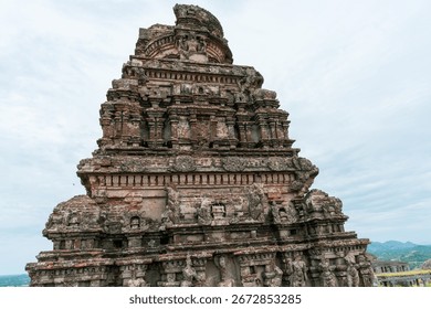 A large building with a lot of bricks and a lot of windows. The building is very tall. Tamil nadu