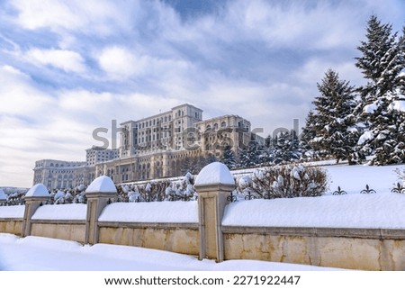 Large building of the Palace of the Parliament also known as People's House (Casa Poporului) in Constitutiei Square (Piata Constitutiei) in Bucharest, Romania, East Europe, in snowy winter scenery. Stock photo © 