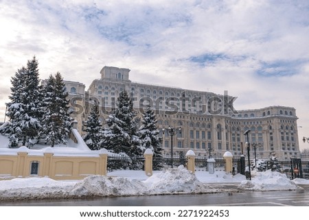 Large building of the Palace of the Parliament also known as People's House (Casa Poporului) in Constitutiei Square (Piata Constitutiei) in Bucharest, Romania, East Europe, in snowy winter scenery. Stock photo © 