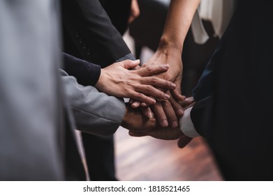 Large Business Team Showing Unity With Their Hands Together, Business Success Concept
