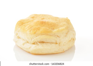 A Large Buttermilk Biscuit On A White Background