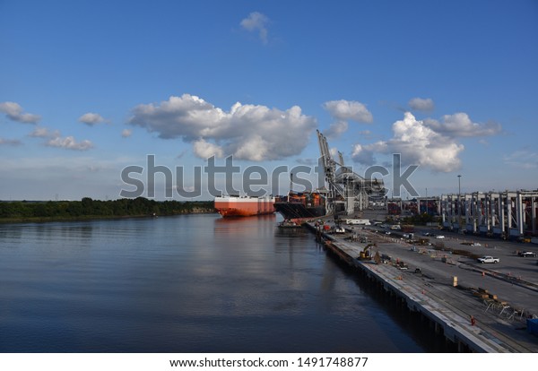 Large car carrier ship arriving to the port of Savannah
on the sunny day. 