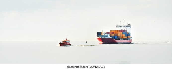 Large Cargo Container Ship Being Led By The Pilot Boat. Piloting Service. Unknown Waters. Global Communications, Logistics, Industry, Freight Transportation, Nautical Vessel, Nautical Route, Port