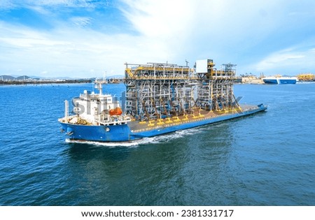 large cargo ship Transporting loads of oil rig parts