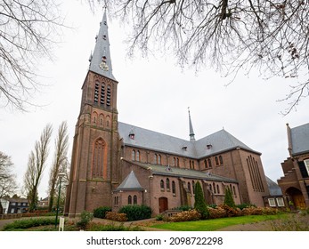Large catholic Saint Willibrord Church in the village of Vleuten, close to the city of Utrecht, Netherlands. Wide angle view.