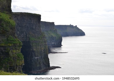 Large cave at the Cliffs of Moher. The Cliffs of Moher are sea cliffs located at the southwestern edge of the Burren region in County Clare, Ireland