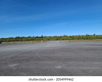 The large cement parking area at an airport. - Shutterstock ID 2054999462