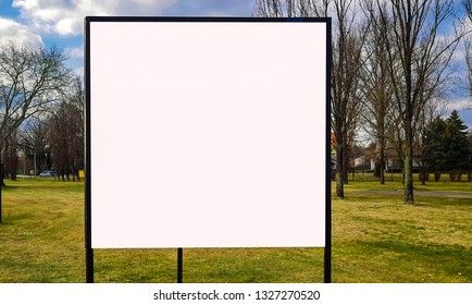 Large City Park White Blank Advertisement Banner Billboard Sign Mock Up With Wooden Frame.Isolated Template Clipping Path