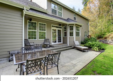 Large Classic House With Patio Area And Green Lawn.