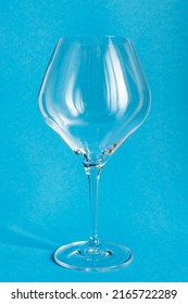 Large Clean Empty Wineglass On Blue Background