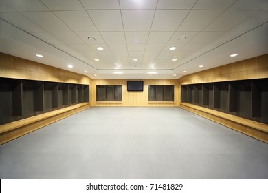 Large Clean Locker Room. Gray Floor And Ceiling, Big Televisor On Wall