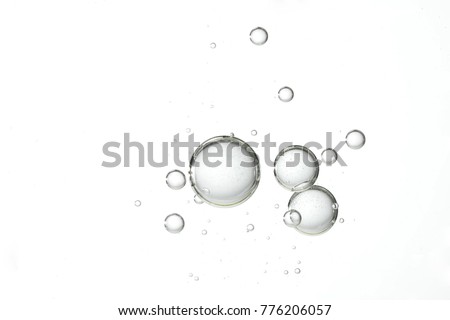 Large and clear water bubbles floats over a white background