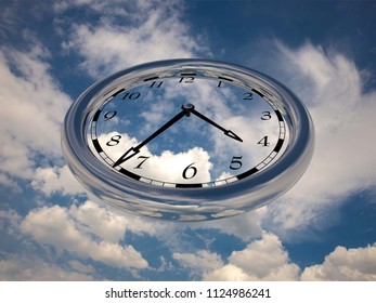 Large clock face with hands that mark the hours on sky background
