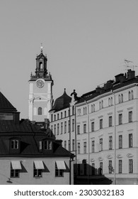 a large clock tower towering over a city