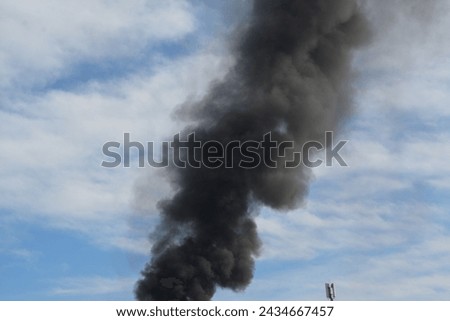 Large cloud of black smoke from a fire