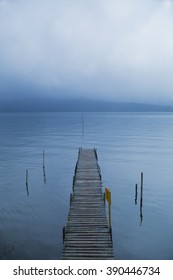 A large cloud of misty over an empty dock in lake - Bali Indonesia