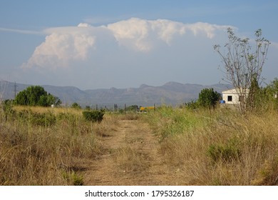 Large Cloud over Mountain Landscape