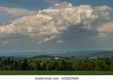 A large cloud over a small town