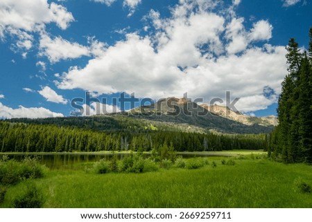 Large Clouds Rise Over Cache Lake And Electric Peak