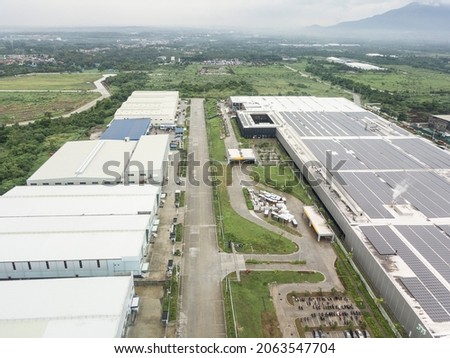 A large cluster of expansive warehouses on former farmland property. Industrial zone in Lipa, Batangas.