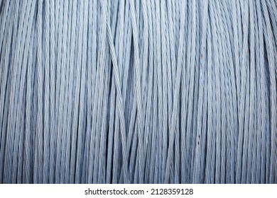 large coil of steel cable, steel braided cable is wound into a roll. - Shutterstock ID 2128359128
