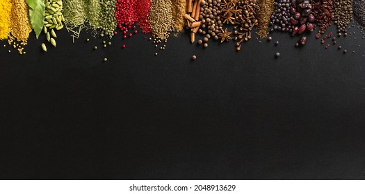 Large collection spices and herbs on background of  black table. Colorful condiments with empty space for text or label. - Shutterstock ID 2048913629