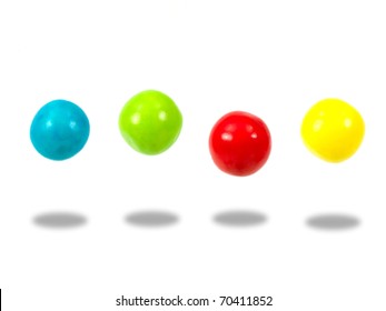Large colored gumballs set against a white background