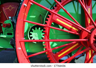 Large colorful gears on an old tractor