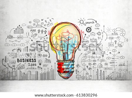 Large and colorful light bulb sketch surrounded by smaller business icons and words drawn on a concrete wall.