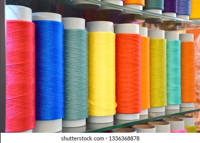Large colorful polypropylene thread set in rainbow mood. Multicolor bobbin thread. Polypropylene multifilament yarns. Set of sewing thread coils, miscellaneous colours.