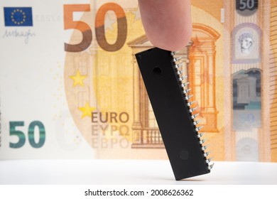 Large Computer Chip Placed Next To 50 Euros Banknote. Concept For Investment In Semiconductor Industry And Golbal Chip Shortage.