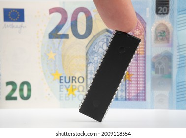 Large Computer Chip Placed Next To 20 Euros Banknote. Concept For Investment In Semiconductor Industry And Golbal Chip Shortage.