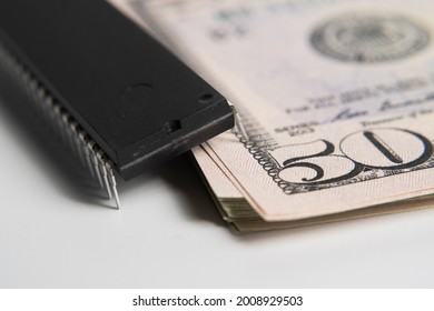 Large Computer Chip Placed On Top Of Stack Of 50 US Dollar Banknotes. Concept For Investment In Semiconductor Industry And Golbal Chip Shortage.