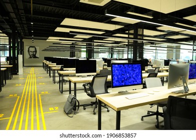 Large Computer Room With Laptops On Tables, Blurred People Working At Workplaces. November 4, 2018. Kyiv, Ukraine