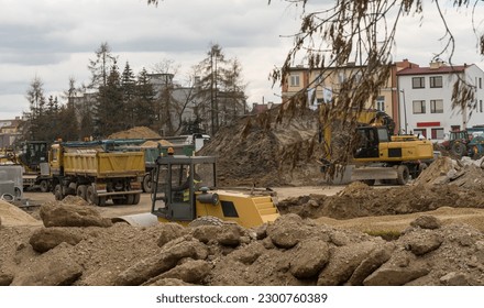 A large construction site in the city. Construction (reconstruction) of the main street. A large construction site, visible machines - excavators, tippers, road rollers, tractors in the 