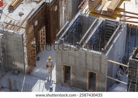 Large construction site with concrete elevator shaft