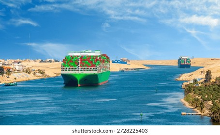 Large container ship, accompanied by tugboat, passing through the Suez Canal in Egypt.