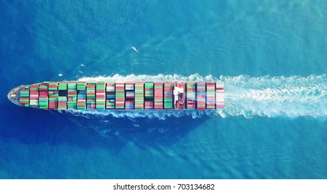 A Large Container Ship Is Leaving The Port Full Loaded With Containers And Cargo - Aerial - Top Down View