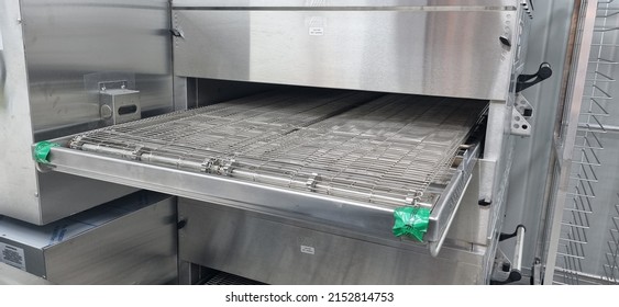 Large Conveyor Oven for pizza or other food in stainless steel - Shutterstock ID 2152814753
