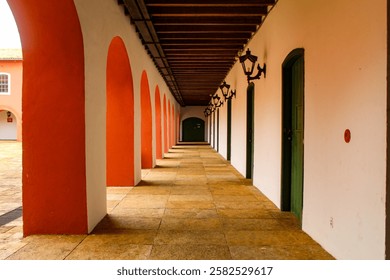 A large corridor with rustic stone flooring, columns and arches in the city of São Luis Ma, northeastern Brazil