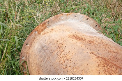 Large Corroded Pipe In The Grass, Selective Focus