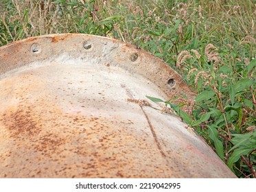 Large Corroded Pipe In The Grass, Selective Focus