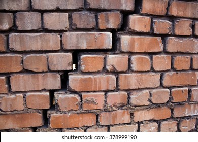 Large crack in the wall of  brick
